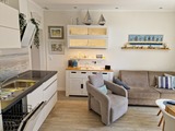 Ferienwohnung in Gr&ouml;mitz - Haus Solymar - Wohnbereich mit offener K&uuml;che, Klimaanlage